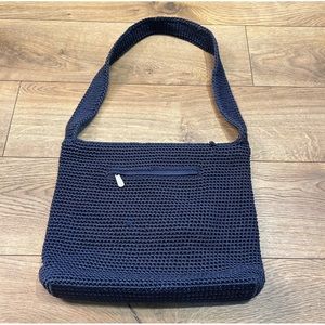 The Sak navy woven crochet handbag with striped liner